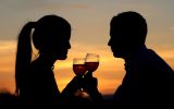 Couple Sipping Wine at Sunset