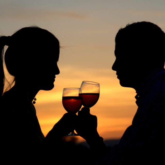 Couple Sipping Wine at Sunset